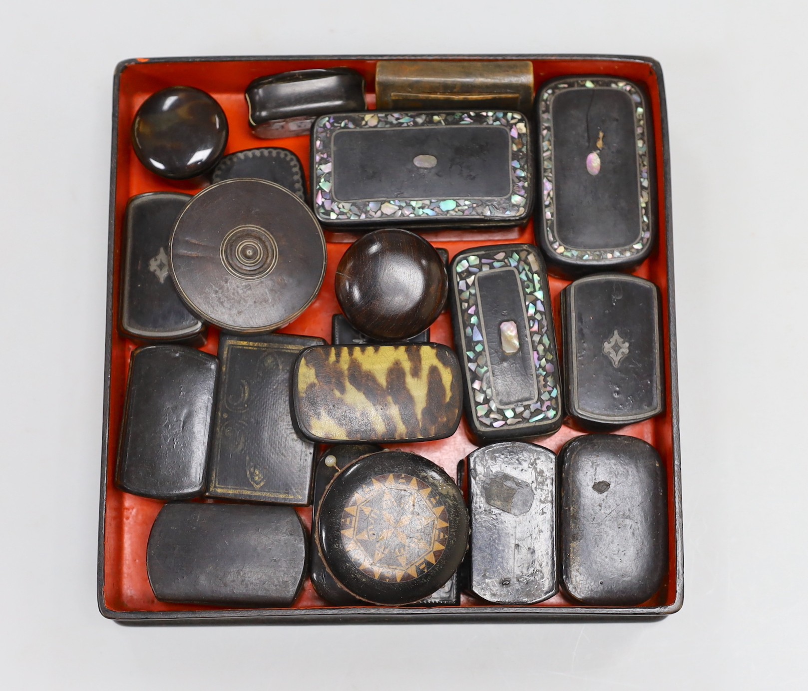 A collection of Victorian papier mache snuff boxes and a Tunbridge ware pin wheel